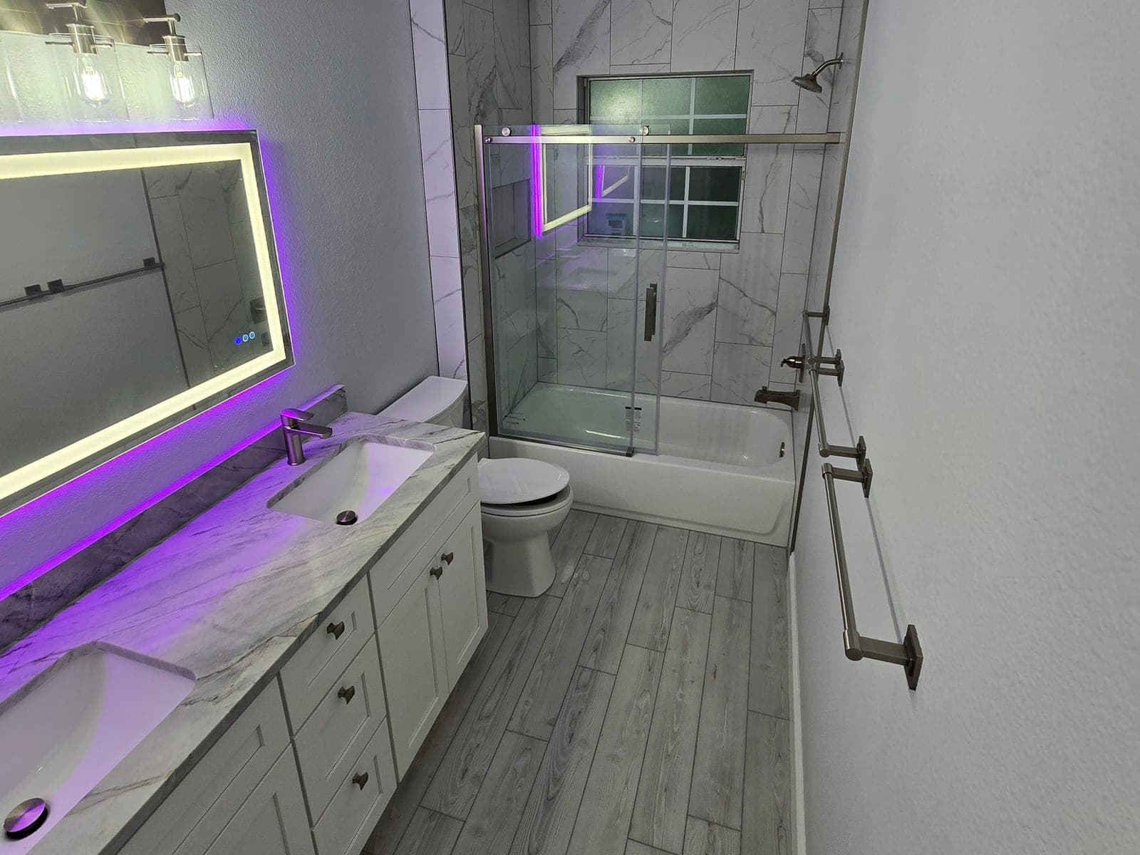 Bathroom double vanity with quartz countertop and backlit LED mirror